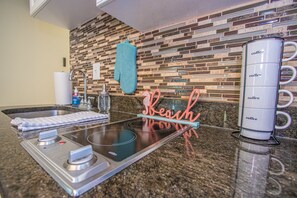 Fridge, microwave, stovetop, coffee/tea maker