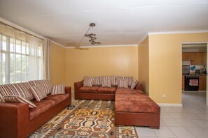 House | Living room | 30-inch TV with cable channels - Cozy and Warm 3-bed Bungalow in Athi River (Athi River)