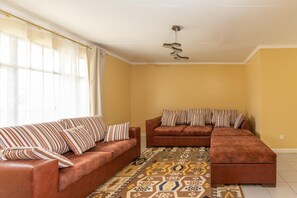House | Living room | 30-inch TV with cable channels - Cozy and Warm 3-bed Bungalow in Athi River (Athi River)