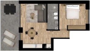 A hotel room layout with a bed, a small sitting area, a kitchenette, and a bathroom.