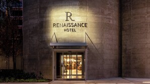The exterior of the Renaissance Hotel with a prominent 'R' logo and the name 'Renaissance Hotel' displayed above the entrance. - Renaissance Bordeaux Hotel (Bordeaux)