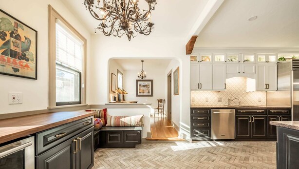 A spacious kitchen with dark cabinetry, a herringbone floor, and a central island. - 5BD Houseblocks From Broadmoor Fireplacecheyenne Canon & Gorgeous Views! (Colorado Springs)