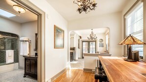 A spacious kitchen with a wooden countertop, a chandelier, and a view of the ocean through the window. - 5BD Houseblocks From Broadmoor Fireplacecheyenne Canon & Gorgeous Views! (Colorado Springs)
