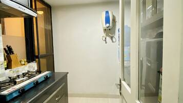 Fridge, stovetop, cookware/dishes/utensils, spices