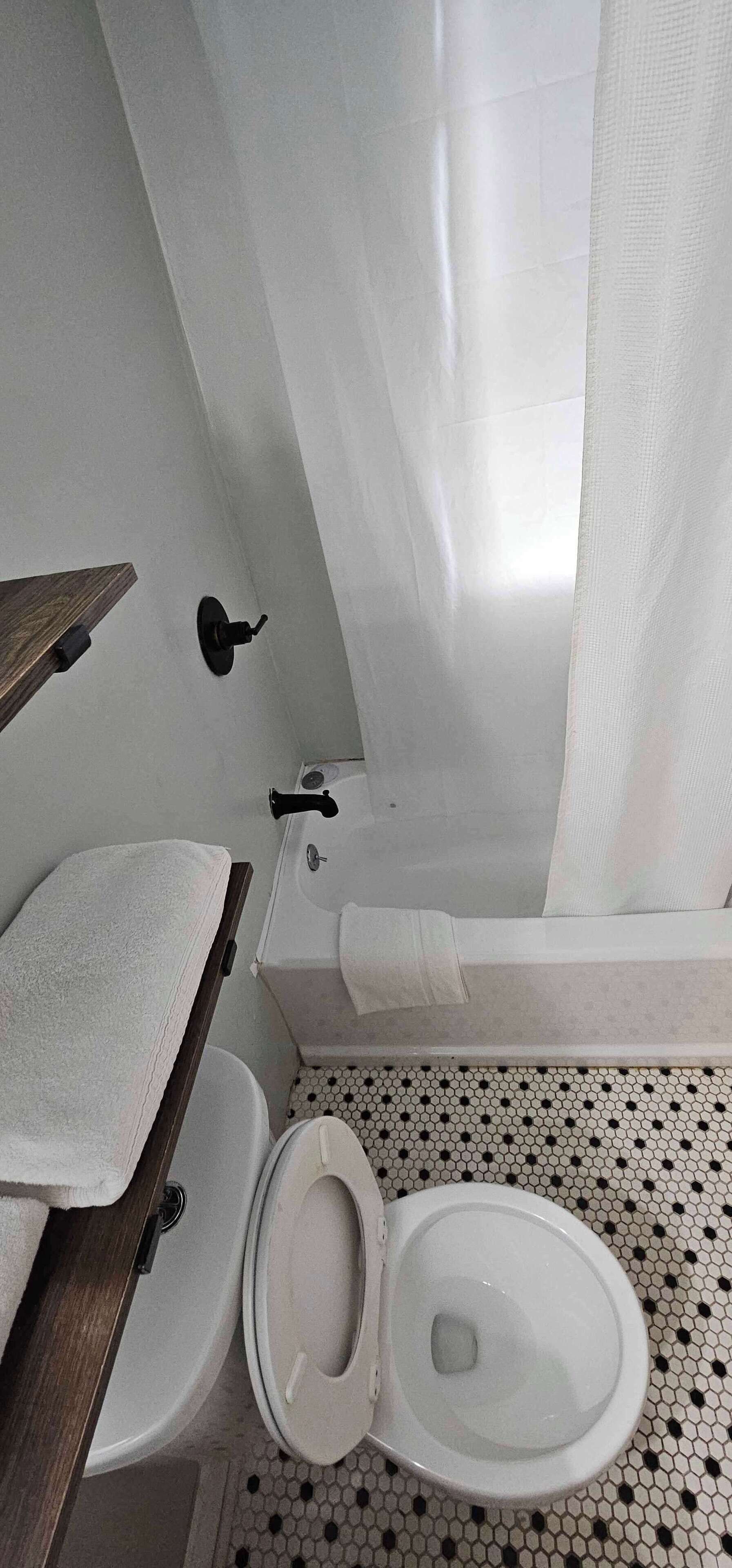 Bathtub, hair dryer, towels