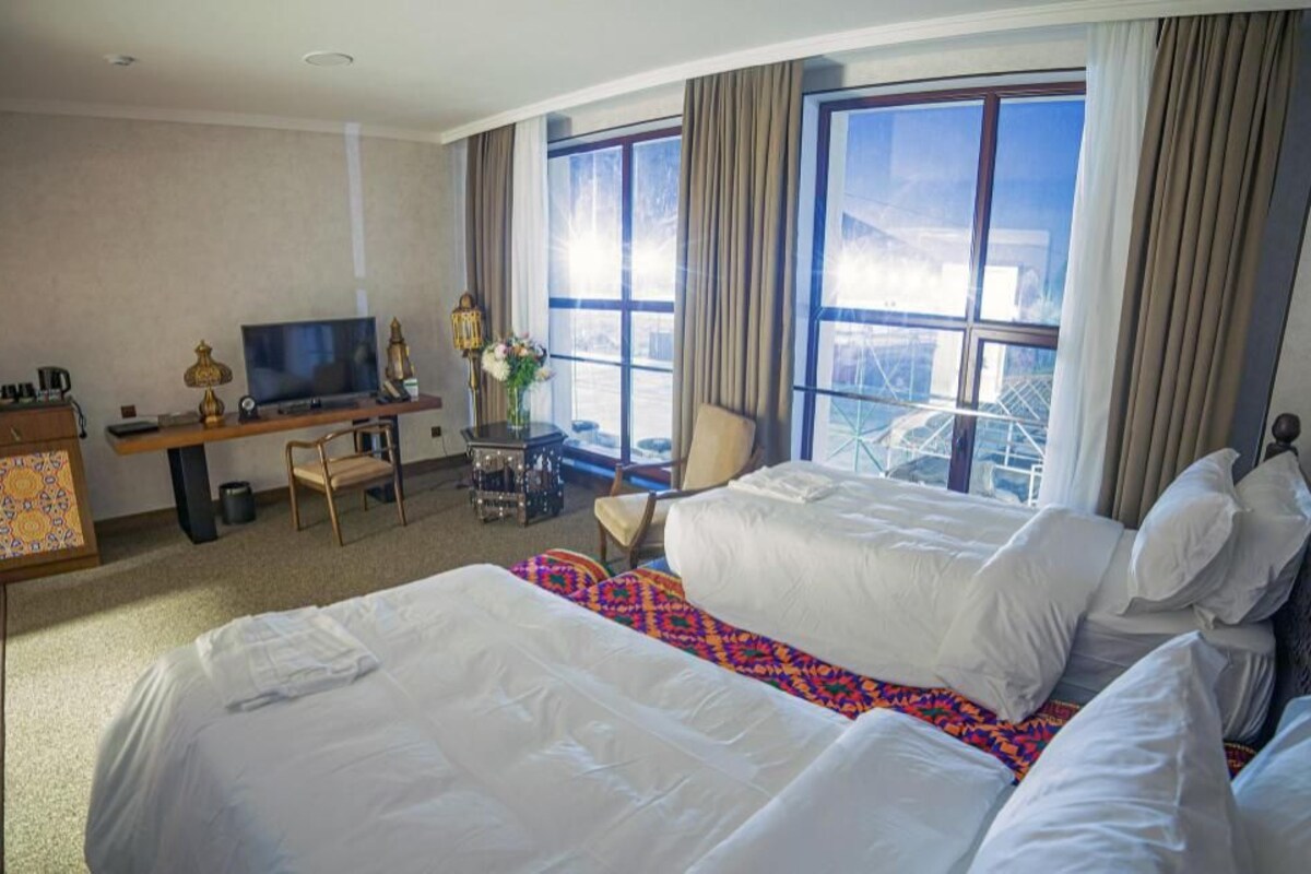 Premium bedding, down comforters, minibar, in-room safe