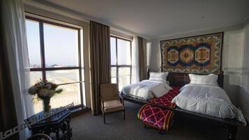 Premium bedding, down comforters, minibar, in-room safe