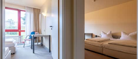 Family Room | Hypo-allergenic bedding, desk, laptop workspace, bed sheets
