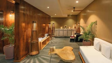 Welcome to our lobby, featuring a reception desk, comfortable seating area, and lush greenery.
