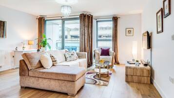 Apartment | Living area | 30-inch Smart TV with cable channels, TV, Netflix