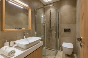 Shower, hair dryer, towels, toilet paper