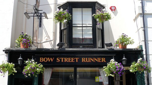 A building with a sign reading "BOW STREET RUNNER" and a sign below stating "Lager, Bitter, Wines, Spirits." - Bow Street Runner (Hove)