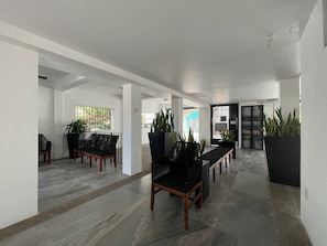 Relax in a spacious lobby with comfortable seating areas and large windows.