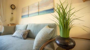 Deluxe Apartment, 1 Bedroom, Sea View | Living area | 40-inch Smart TV with satellite channels, TV