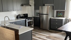 Coffee/tea maker, fridge, microwave, oven