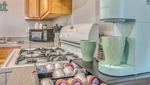A kitchen with a coffee maker, a microwave, and a gas stove. - ✨ BY FORT BLISS: 2 KING BEDS, FAST WIFI, FULL BATH, LAUNDRY (El Paso)