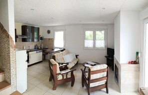 Compact living space with a kitchen, dining area, and cozy seating arrangement.