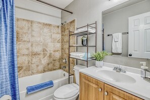 Combined shower/tub, hair dryer, towels, soap
