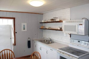 Fridge, microwave, oven, stovetop - St. Martins Sea Caves Cottage · Covered Veranda (Saint Martins Parish)