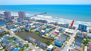 An aerial view of a coastal residential area with a beach, a pier, and a body of water. - Sea Aire II Duplex Up, Pet Friendly, Oceanfront, Shared Game Room (North Myrtle Beach)