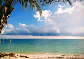 On the beach, sun-loungers, beach towels