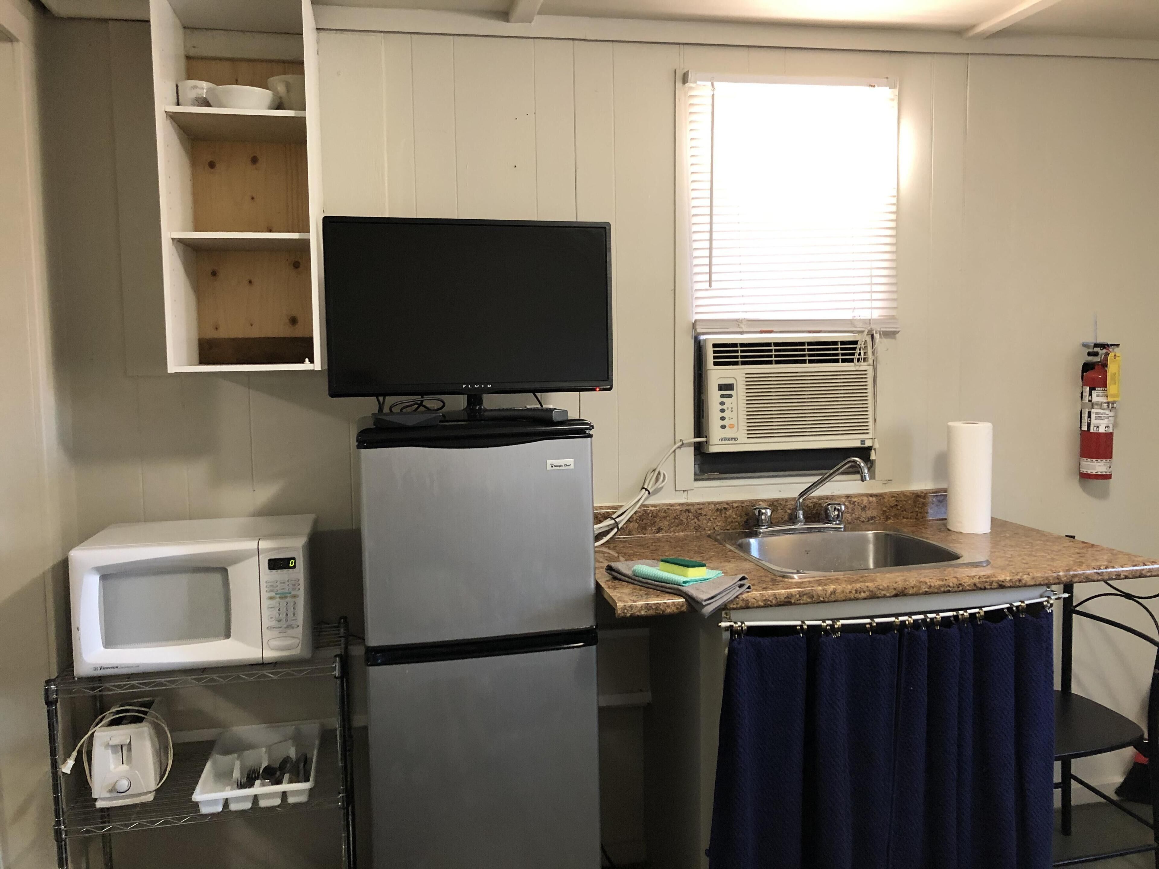 Coffee/tea maker, fridge, microwave, cookware/dishes/utensils