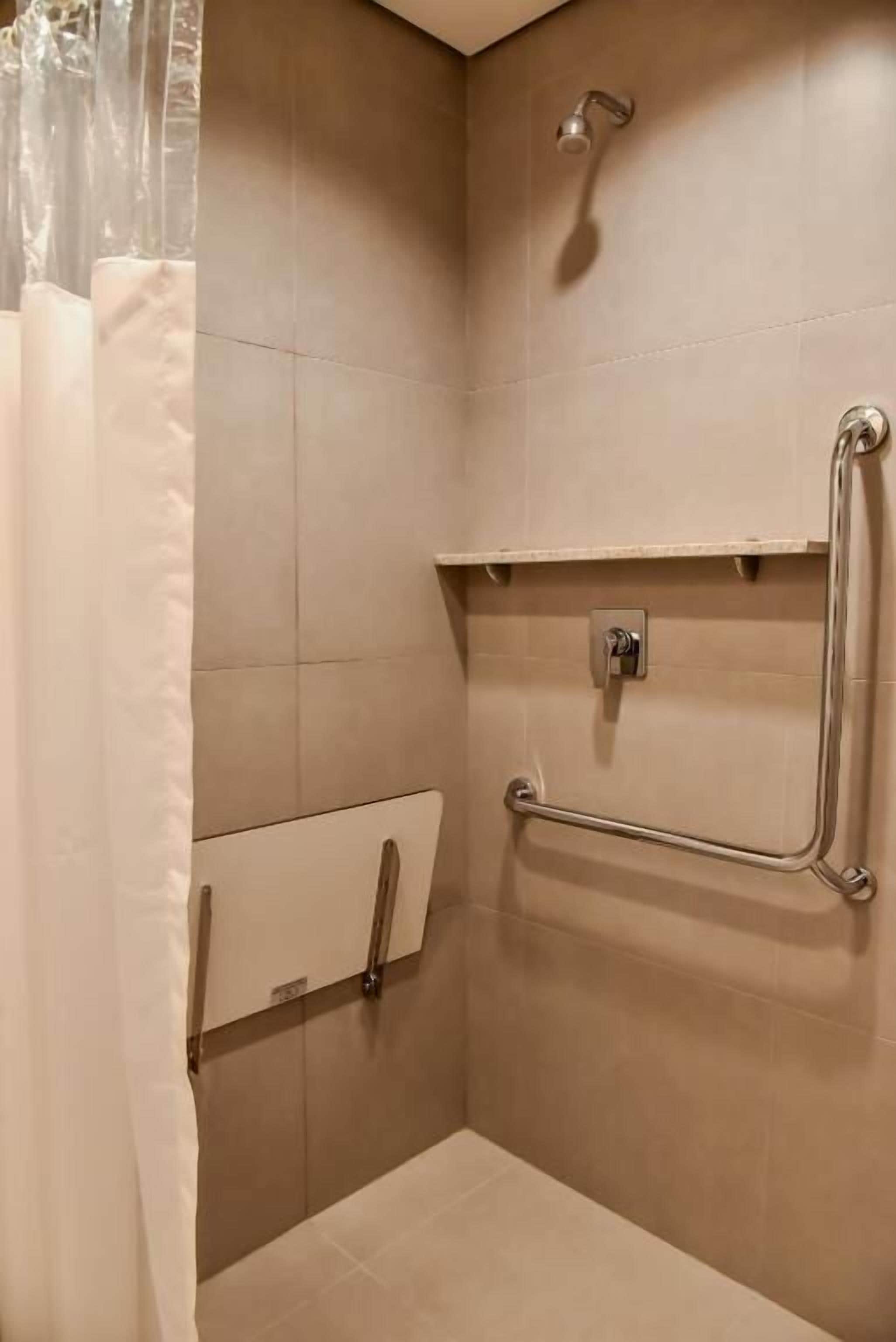 superior triple room, mobility accessible | bathroom | shower, eco-friendly toiletries