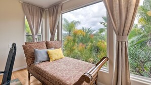 A bedroom with a bed, a chair, and a window with curtains. - Two Homes, One
 Lot Sleeps 18, Pool & Hot Tub Private Villa, 9 miles from beach. (Vista)