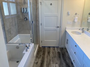 Combined shower/tub, hair dryer, towels, soap