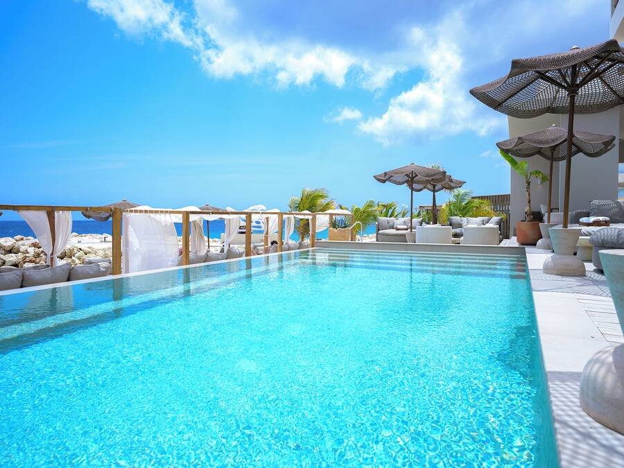 Outdoor pool, open 10:00 AM to 6:00 PM, pool cabanas (surcharge)