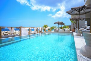 Outdoor pool, open 10:00 AM to 6:00 PM, cabanas (surcharge)