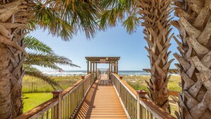 A wooden boardwalk leading to a gazebo with a view of the beach and ocean. - Breathtaking Panoramic Views of the Gulf (Pensacola)