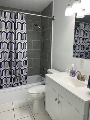 Combined shower/tub, towels, soap, toilet paper
