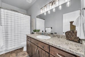 Combined shower/tub, hair dryer, towels, soap
