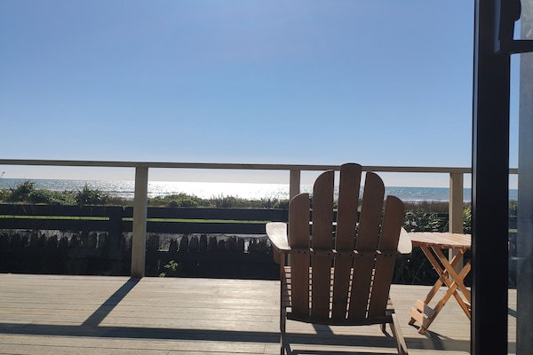 View from lounge out to deck and across to the ocean.