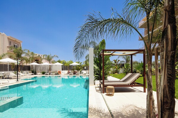 Seasonal outdoor pool, pool umbrellas, pool loungers