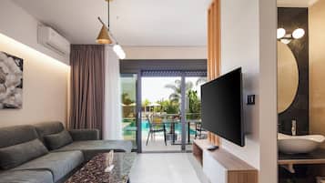 Superior Two Bedroom Suite with Pool View | Living area | 32-inch Smart TV with cable channels, TV