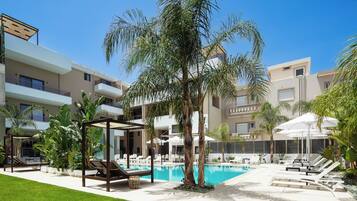 Seasonal outdoor pool, pool umbrellas, pool loungers