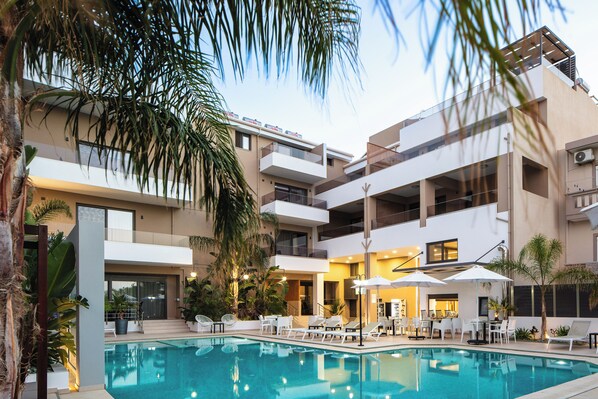 Seasonal outdoor pool, pool umbrellas, pool loungers