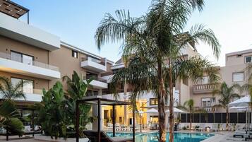 Seasonal outdoor pool, pool umbrellas, pool loungers