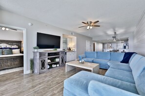Flat-screen TV, DVD player, books, stereo
