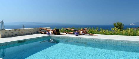 Seasonal outdoor pool, pool umbrellas, pool loungers