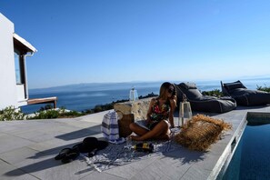 Seasonal outdoor pool, pool umbrellas, pool loungers