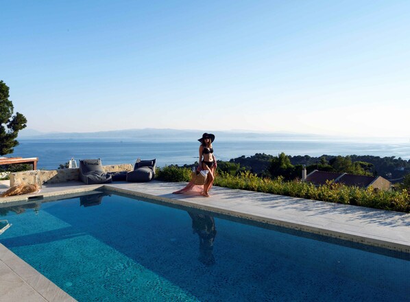 Seasonal outdoor pool, pool umbrellas, pool loungers