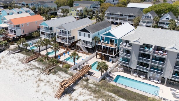 A coastal hotel with multiple balconies, a pool area, and beach access. - Oceanfront 5 BR Beach House in Surfside Beach with Private Pool! LA ESMERALDA II (Surfside Beach)