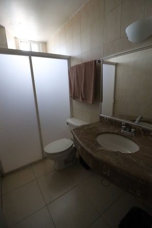 Shower, rainfall showerhead, towels, soap