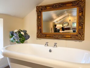 Bathtub, hair dryer, towels, soap