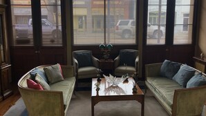 A living room with two sofas, a coffee table, and a lamp. - The Law Building (Natchez)