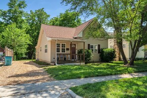 Set amidst a serene and lawn, this charming home offers a peaceful retreat.
