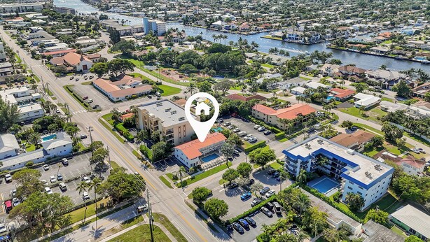 An aerial view of a residential area with a hotel marked by a pin icon. - Boutique Hotel King room w/ POOL, LOCATION! Walk to BEACH/Restaurants/Nightlife (Deerfield Beach)